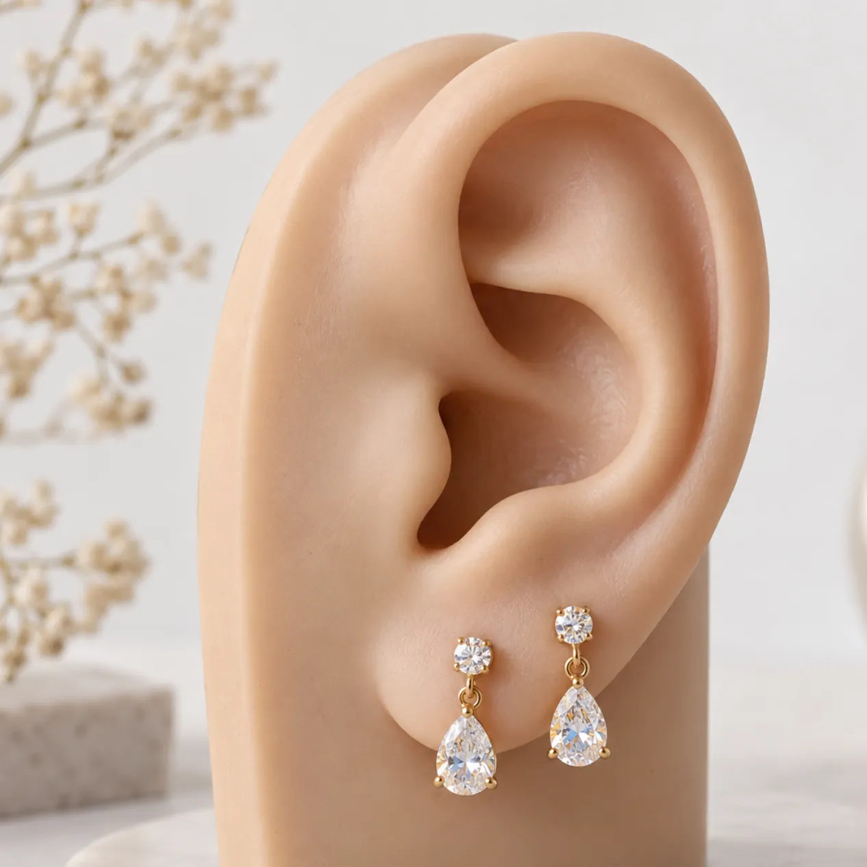 Earring wearing reference showing the full ear and jewelry scale